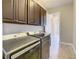 Spacious laundry room, with modern washer and dryer, and direct access to connecting rooms at 8491 Pippen Dr, Orlando, FL 32836