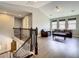Open-concept living area with hardwood floors, three windows and comfortable seating at 8491 Pippen Dr, Orlando, FL 32836