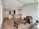 Spacious living room with hardwood floors, neutral walls and an armchair at 8491 Pippen Dr, Orlando, FL 32836