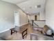 Loft featuring vaulted ceilings, hardwood floors, and an airy seating area at 8491 Pippen Dr, Orlando, FL 32836