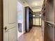 Spacious walk-in closet with custom storage solutions and hardwood floors at 8491 Pippen Dr, Orlando, FL 32836