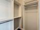 Bright walk-in closet featuring adjustable shelves and multiple hanging rods at 8491 Pippen Dr, Orlando, FL 32836