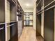 Massive walk-in closet provides ample storage with shelves, drawers, and hanging rods at 8491 Pippen Dr, Orlando, FL 32836