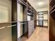 Expansive walk-in closet with custom shelving, drawer units, and hanging spaces at 8491 Pippen Dr, Orlando, FL 32836
