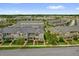 Neighborhood aerial showcasing multiple residential homes, lush landscaping, and orderly street layout at 8500 Iron Mountain Trl, Windermere, FL 34786