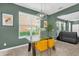 Bright dining room featuring a glass table, modern lighting, and large window at 8500 Iron Mountain Trl, Windermere, FL 34786