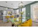 Bright dining area with modern lighting fixtures and access to outdoor patio at 8500 Iron Mountain Trl, Windermere, FL 34786