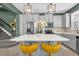 Bright kitchen featuring modern appliances, a center island with seating, and stylish pendant lights at 8500 Iron Mountain Trl, Windermere, FL 34786