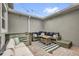 Inviting patio area with comfortable seating, stylish rug, and string lights at 8500 Iron Mountain Trl, Windermere, FL 34786