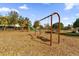 Community playground with swings, a slide, and a soft mulch surface for safe play at 8500 Iron Mountain Trl, Windermere, FL 34786