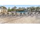 Resort-style community pool with ample lounge seating, umbrellas, and a pool house at 8500 Iron Mountain Trl, Windermere, FL 34786