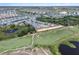 Aerial view of neighborhood near large golf course with ponds at 8807 Interlocking Ct, Davenport, FL 33896