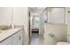 This bathroom features a modern sink, tiled shower, and bright, clean design at 8807 Interlocking Ct, Davenport, FL 33896
