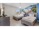 Elegant bedroom with two queen beds, stylish decor, a mural of a castle, and a modern dresser at 8807 Interlocking Ct, Davenport, FL 33896