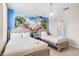 The whimsical bedroom features a fun mural, stylish beds, and modern lighting at 8807 Interlocking Ct, Davenport, FL 33896