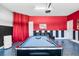 Recreational area featuring a pool table and unique wall decor for entertainment and relaxation at 8807 Interlocking Ct, Davenport, FL 33896