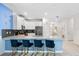Stylish eat-in kitchen with white cabinets, stainless steel appliances, and a counter with bar stool seating at 8807 Interlocking Ct, Davenport, FL 33896