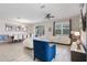 Bright, open-concept living area features tile floors, modern decor, and ample seating including a large sectional sofa at 8807 Interlocking Ct, Davenport, FL 33896