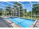 Private screened pool with jacuzzi and lounge chairs for ultimate relaxation and enjoyment at 8807 Interlocking Ct, Davenport, FL 33896