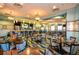 An interior view of the restaurant, featuring tables, chairs, and a bar at 8807 Interlocking Ct, Davenport, FL 33896