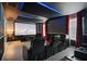 Home theater setup with tiered seating, a large screen, and star-lit ceiling for an immersive experience at 8807 Interlocking Ct, Davenport, FL 33896