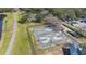 Aerial view of a community basketball court with a walking path and parking area nearby at 9141 Camden Gardens St, Orlando, FL 32827