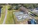 Aerial view of a community basketball court featuring a walking path and covered seating area at 9141 Camden Gardens St, Orlando, FL 32827