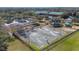 Overhead view of the fenced basketball court surrounded by mature trees, offering an active community space at 9141 Camden Gardens St, Orlando, FL 32827