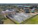 Aerial view of community basketball court featuring lighting, fencing, and covered seating area at 9141 Camden Gardens St, Orlando, FL 32827