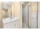 Well-lit bathroom with shower and vanity at 9141 Camden Gardens St, Orlando, FL 32827