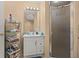 Practical bathroom featuring a shower, sleek vanity, and storage solutions at 9141 Camden Gardens St, Orlando, FL 32827