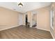 Bright, spacious bedroom featuring laminate floors, closet, and ensuite bathroom at 9141 Camden Gardens St, Orlando, FL 32827