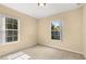 This bedroom has carpet and two windows for plenty of natural light at 9141 Camden Gardens St, Orlando, FL 32827