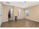 Spacious bedroom with laminate flooring, walk-in closet, and an ensuite bathroom entrance at 9141 Camden Gardens St, Orlando, FL 32827