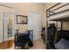 Cozy bedroom featuring a desk, chair, and a functional bunk bed with integrated treadmill at 9141 Camden Gardens St, Orlando, FL 32827