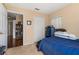 Cozy bedroom featuring a double door closet, neutral walls, and carpet flooring at 9141 Camden Gardens St, Orlando, FL 32827