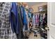 Walk-in closet featuring ample storage and built-in shelving at 9141 Camden Gardens St, Orlando, FL 32827