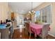 Cozy dining room with natural light next to the kitchen with tile floors at 9141 Camden Gardens St, Orlando, FL 32827