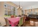 Bright dining room with hardwood floors featuring windows with lots of natural light at 9141 Camden Gardens St, Orlando, FL 32827