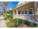 Charming exterior view of the home with well-maintained landscaping and inviting front porch at 9141 Camden Gardens St, Orlando, FL 32827