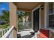 Welcoming front porch adorned with plants and seating, leading to the house's front door at 9141 Camden Gardens St, Orlando, FL 32827