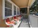Inviting front porch featuring comfortable seating, perfect for relaxing and enjoying the outdoors at 9141 Camden Gardens St, Orlando, FL 32827