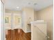 Hallway with wood floors and natural light at 9141 Camden Gardens St, Orlando, FL 32827