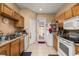 Practical kitchen with tile floors, essential appliances, and convenient outside access at 9141 Camden Gardens St, Orlando, FL 32827
