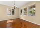 Bright and airy living room with large windows and a decorative chandelier for added ambiance at 9141 Camden Gardens St, Orlando, FL 32827