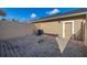 Paver patio featuring an air conditioning unit and a door leading to the exterior at 9141 Camden Gardens St, Orlando, FL 32827