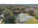 Aerial view of community tennis courts surrounded by lush greenery, perfect for active living at 9141 Camden Gardens St, Orlando, FL 32827