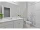 Clean bathroom with a white vanity top, modern fixtures, and a shower/tub combo at 9845 Emerald Berry Dr, Winter Garden, FL 34787
