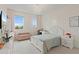 Charming bedroom with decorative wallpaper, natural light, and a cozy bed at 9845 Emerald Berry Dr, Winter Garden, FL 34787