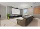 Enjoy movie nights in this bonus room with a large screen, projector and comfortable sectional sofa at 9845 Emerald Berry Dr, Winter Garden, FL 34787